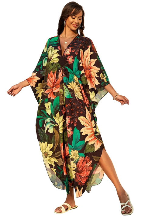 Woman wearing a colorful floral dress in a bright outdoor setting